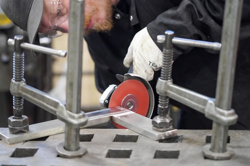 Tiger 3D MAX ceramic resin fiber disc grinding a welded stainless steel bracket