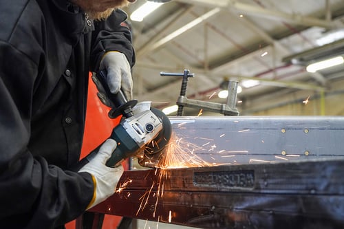 Tiger 3D MAX ceramic resin fiber disc removing a large weld from steel