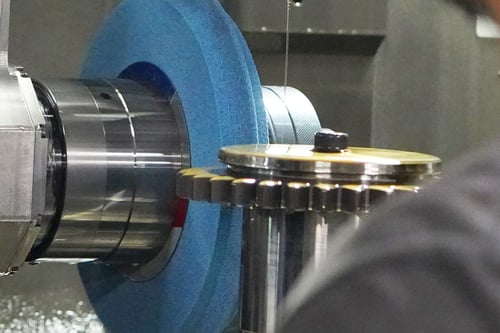 Single profile gear wheel approaching a gear in a work center.