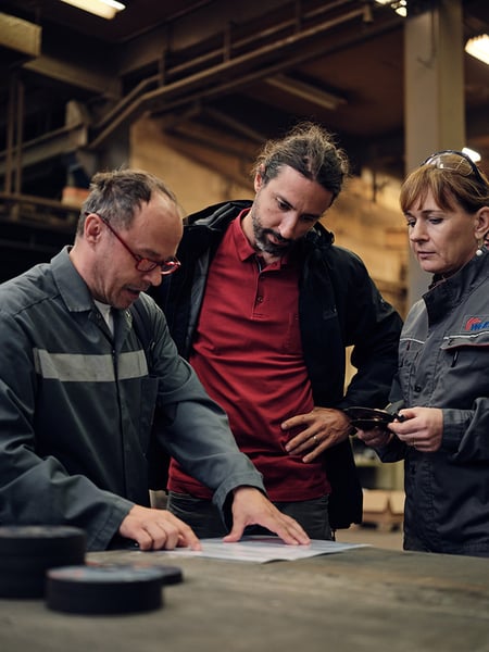 Weiler experts presenting testing data to a plant manager.