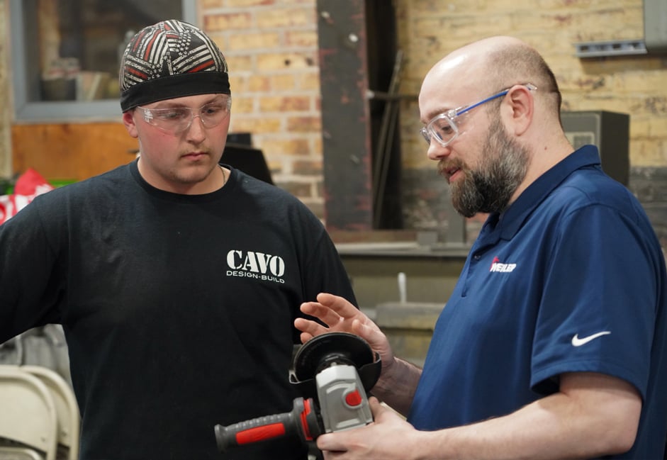 Application Expert discussing surface contact of a discs with an operator.