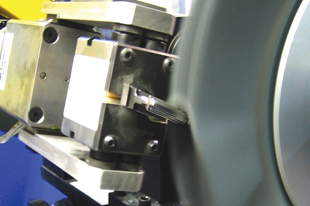Nylox abrasive nylon brush deburring a turbine blade.
