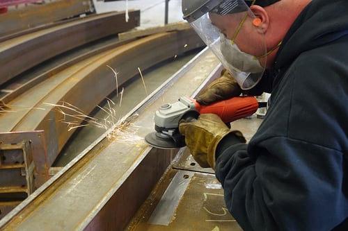 Tiger 3D MAX ceramic resin fiber disc grinding a weld on a roller coaster steel beam