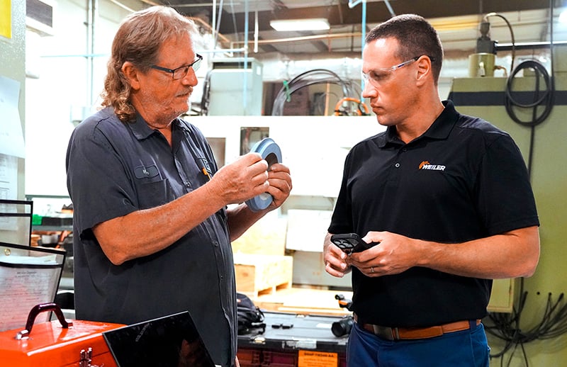 Weiler expert and operator reviewing grinding wheel expectations.