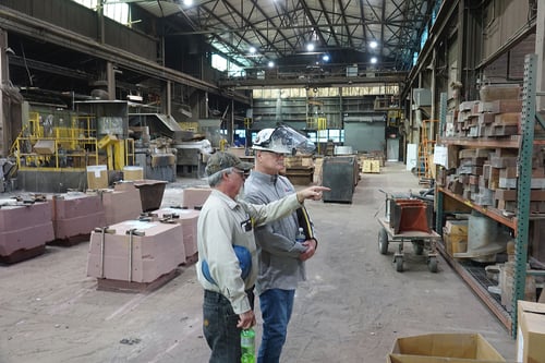 David Jescovitch of Weiler Abrasives is speaking with a plant manager at a foundry to understand the plant's improvement goals.
