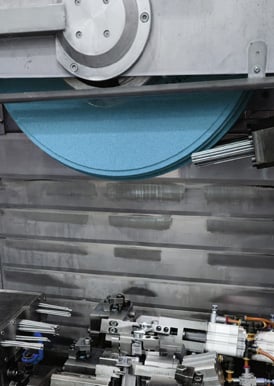 Weiler wheel grinding a turbine blade.