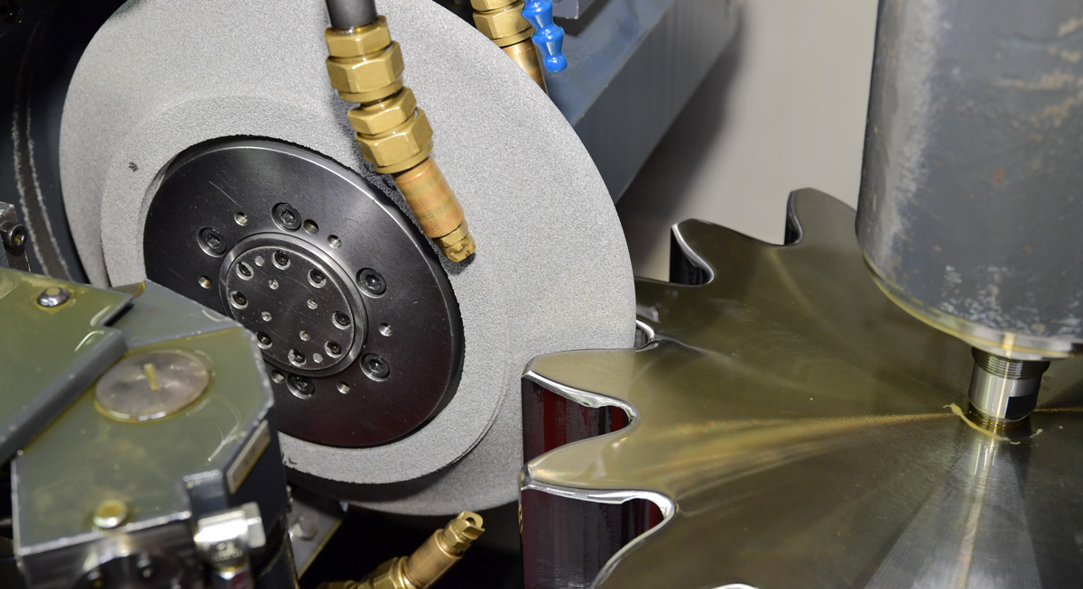 Vitrified grinding wheel grinding a gear Vitrified grinding wheel grinding a gear